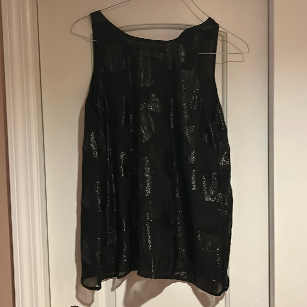 Black top with sparkly thread. Pre-owned. Worn once.